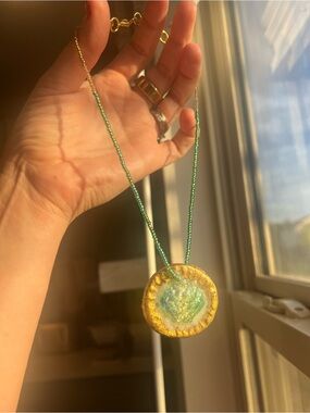 Green Shell and Gold Beaded Necklace with Gold Resin Pendant